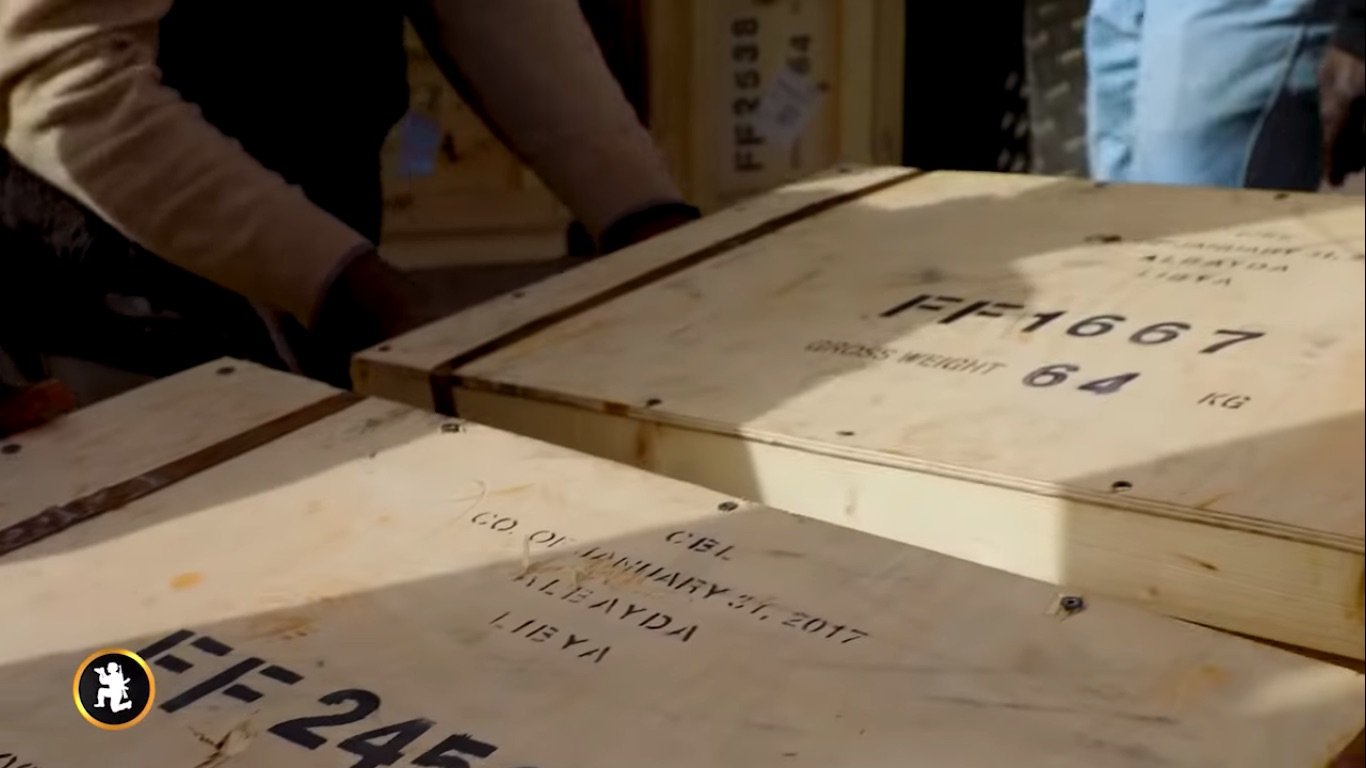 Crates marked from Al Bayda city were delivered by the IL-76 plane (Screenshot via YouTube)