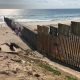 The U.S.-Mexico border wall extends into the Pacific Ocean with Playa Tijuana, Mexico to the south and San Ysidro, California to the north. The existing wall was built during the Clinton Administration. (Photo: Lauren von Bernuth)