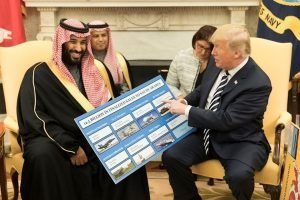 President Donald J. Trump, joined by crown prince Mohammed bin Salman, shows informational boards showing how much business the Kingdom of Saudi Arabia generates for the U.S. economy after their meeting at the White House in March, 2018. (Photo: Official White House photo, Shealah Craighead)