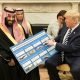 President Donald J. Trump, joined by crown prince Mohammed bin Salman, shows informational boards showing how much business the Kingdom of Saudi Arabia generates for the U.S. economy after their meeting at the White House in March, 2018. (Photo: Official White House photo, Shealah Craighead)