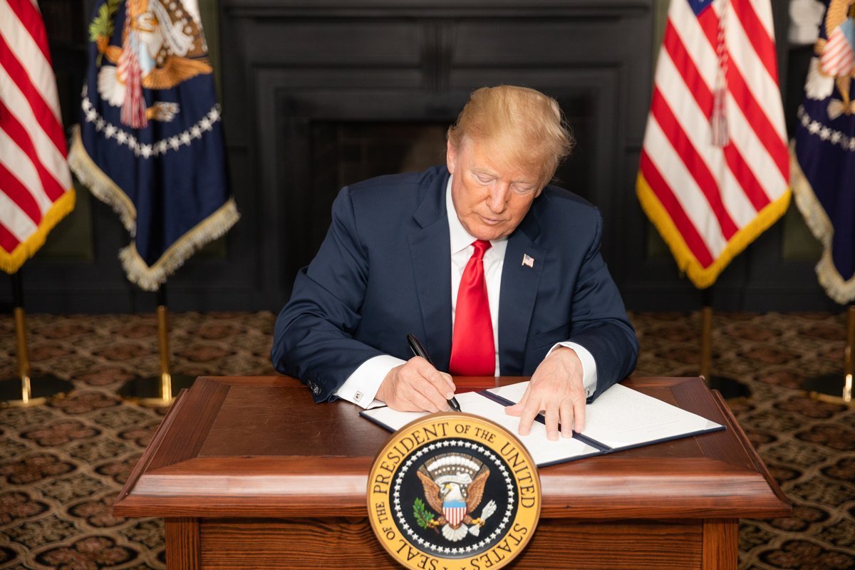 President Donald J. Trump signs an Executive Order in Bedminster, New Jersey, entitled “Reimposing Certain Sanctions with Respect to Iran.” (Official White House Photo by Shealah Craighead)