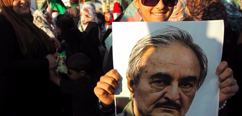 Supporter holding a picture of rebel leader Khalifa Haftar