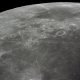 This 70mm handheld camera's view of the moon, photographed during the Apollo 16 mission's trans-Earth coast, features Mare Fecunditatis (Sea of Fertility) in the foreground with the twin craters Messier at the lower right. Nearer the horizon is Mare Nectaris (Sea of Nectar) with craters Goclenius and Gutenberg in between. Goclenius is located at approximately 10 degrees south latitude and 45 degrees east longitude.