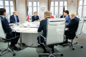 President Donald J. Trump joins G7 Leaders Italian Prime Minister Giuseppe Conte; European Council President Donald Tusk; Japan Prime Minister Shinzo Abe; United Kingdom Prime Minister Boris Johnson; German Chancellor Angela Merkel; Canadian Prime Minister Justin Trudeau and G7 Summit host French President Emmanuel Macron during a G7 Working Session on Global Economy, Foreign Policy and Security Affairs at the Centre de Congrés Bellevue Sunday, Aug. 25, 2019, in Biarritz, France. (Official White House Photo by Shealah Craighead)