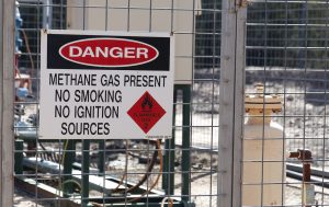 A sign warning of methane present at a well facility. (Photo: Jeremy Buckingham)