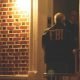 An FBI agent knocks on a door in Brooklyn in 2011 as part of a raid on N.Y. mafia. (Photo: FBI)