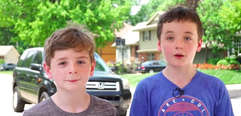 Ben and Carter Wilson, ages 10 and 8, set up a lemonade stand in front of their Overland Park, Kansas, home