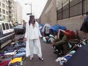 Homeless-Civil Rights activists Ted Hayes at sidewalk encampment in downtown Los Angeles Central City East District, dubbed Skid Row, the national capital, "ground 0" and "black hole" of homelessness.