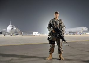 U.S. Air Force Airman 1st Class Frankie Piland watches over the flightline at an air base in the Middle East Jan. 31, 2010.