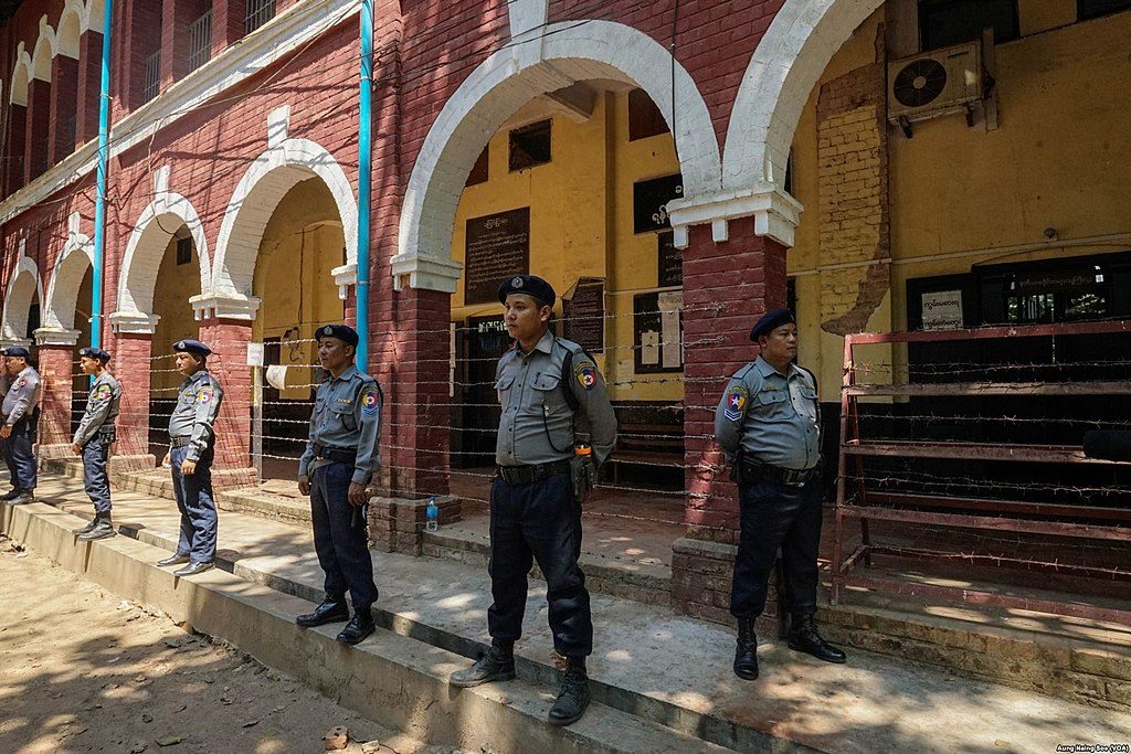 Myanmar police officers stand on guard outside a courtroom in Insein Township during Wa Lone and Kyaw Soe Oo's trial.