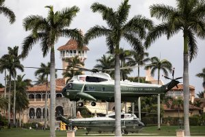 President Donald J. Trump aboard Marine One lands back at Mar-a-Lago as an escort helicopter hovers Friday, March 29, 2019