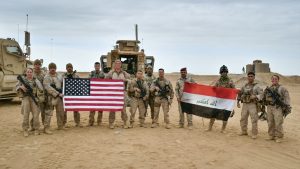 U.S. Marines deployed in support of Combined Joint Task Force Operation Inherent Resolve pose with Iraqi service members in Iraq, Nov. 27, 2017.