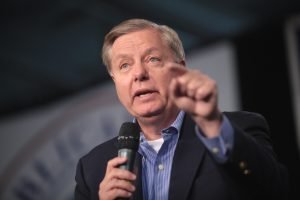 U.S. Senator Lindsey Graham speaking with attendees at the 2015 Iowa Growth & Opportunity Party at the Varied Industries Building at the Iowa State Fairgrounds in Des Moines, Iowa.