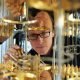 In this photo, IBM scientist Stefan Filipp, takes a closer look at the cryogenic refrigerator which will keep qubits are temperatures colder than the deepest parts of outer space.
