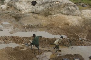 A gold mines in the Congo with two teenage miners.