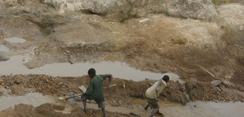 A gold mines in the Congo with two teenage miners.