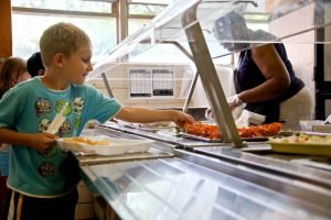 child getting his school lunch