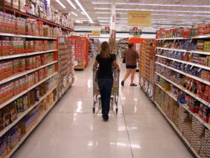 Woman shopping at a grocery store.