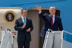 President Donald Trump (right) and Kentucky Gov. Matt Bevin greet supporters as they arrive at the Kentucky Air National Guard Base in Louisville, Ky., Aug. 21, 2019. Trump was in town to speak at an AMVETS convention and attend a fundraiser for Bevin’s re-election campaign.