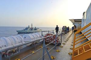 An escort ship, left, pulls alongside the container ship MV Cape Ray in the Mediterranean Sea July 5, 2014, before the Cape Ray begins operations to neutralize specific chemical materials from Syria in accordance with guidelines of the Organization for the Prohibition of Chemical Weapons for operations in international waters. The escort ship was part of an international task force assigned to protect the Cape Ray. The U.S. government-owned Cape Ray was modified and deployed to the eastern Mediterranean Sea to dispose of Syrian chemical agents in accordance with terms Syria agreed to in late 2013.