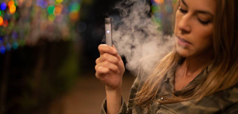 teen using a vaporizer or e-cigarette