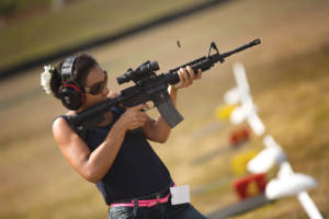 Sarah Richardson, a friend of a Department of Defense employee who works on Marine Corps Base Hawaii, Fires an M4A1 service rifle during the recreational shoot hosted by the Kaneohe Bay Range Training Facility aboard the base. (U.S. Marine Corps Photo By Cpl. Matthew Callahan)