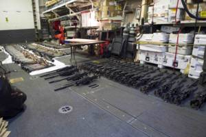 (March 31, 2016) A cache of weapons is assembled on the deck of the guided-missile destroyer USS Gravely (DDG 107). The weapons were seized from a stateless dhow, which was intercepted by the Coastal Patrol ship USS Sirocco (PC 6) on March 28. The illicit cargo included 1,500 AK-47s, 200 RPG launchers, and 21 .50 caliber machine guns. Gravely supported the seizure following the discovery of the weapons by Sirocco's boarding team. This seizure was the third time in recent weeks international naval forces operating in the waters of the Arabian Sea seized a shipment of illicit arms, which the United States assessed, originated in Iran and was likely bound for Houthi insurgents in Yemen. The weapons are now in U.S. custody awaiting final disposition. (Photo by U.S. Navy Photo by Mass Communication Specialist 2nd Class Darby C. Dillon/Released)