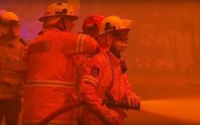 Firefighters battle record setting Australian fires in New South Wales. (Photo: YouTube)