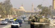 A Marine Corps M1 Abrams tank patrols a Baghdad street after its fall in 2003 during Operation Iraqi Freedom.