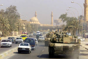 A Marine Corps M1 Abrams tank patrols a Baghdad street after its fall in 2003 during Operation Iraqi Freedom.