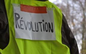 A Yellow Vest protester in France. The Yellow Vest movement which began in October 2018 spans the political spectrum but arose out of frustration with the Macron government. (Photo: Pixabay)