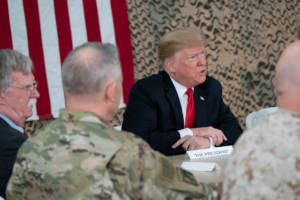 President Donald J. Trump, joined by First Lady Melania Trump, attends a briefing with military leadership members Wednesday, December 26, 2018, at the Al-Asad Airbase in Iraq. (Official White House Photo by Shealah Craighead)