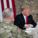 President Donald J. Trump, joined by First Lady Melania Trump, attends a briefing with military leadership members Wednesday, December 26, 2018, at the Al-Asad Airbase in Iraq. (Official White House Photo by Shealah Craighead)