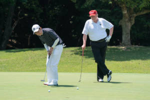 President Donald J. Trump watches as Japan Prime Minister Shinzo Abe makes a putt during their golf game Sunday, May 26, 2019, at the Mobara Country Club in Chiba, Japan. (Official White House Photo by Shealah Craighead)