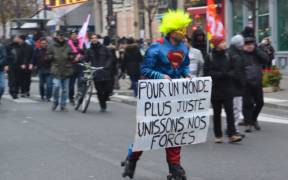 French protester on December 5, 2019 protesting against French President Emmanuel Macron's planned pension reform.