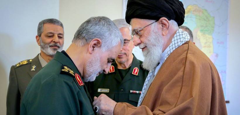 Qasem Soleimani receiving the Zolfaghar Order from Iran's Ayatollah Ali Khamenei.