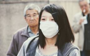 Chinese woman with medical mask on